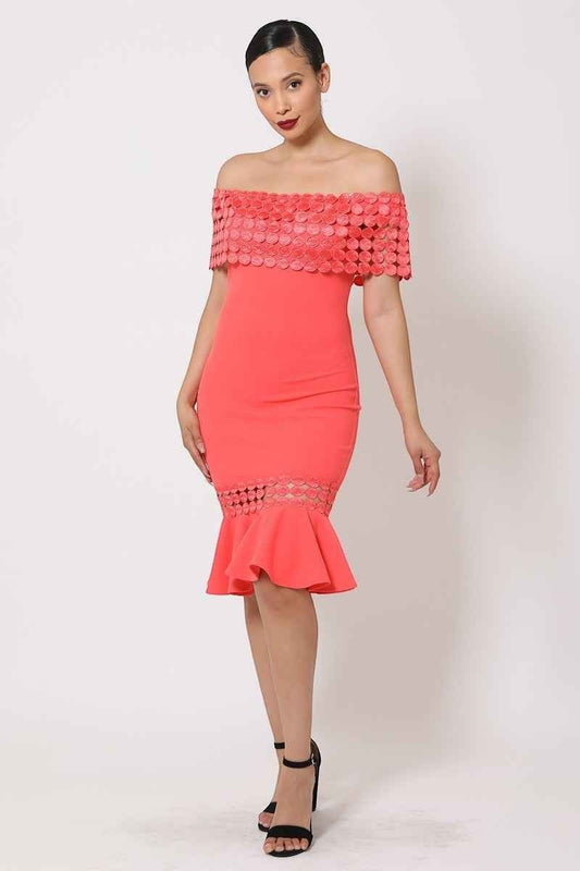 Model wearing a CJSHOPPE.NET salmon off-shoulder dress with crochet band detail and a flattering flare bottom hem.